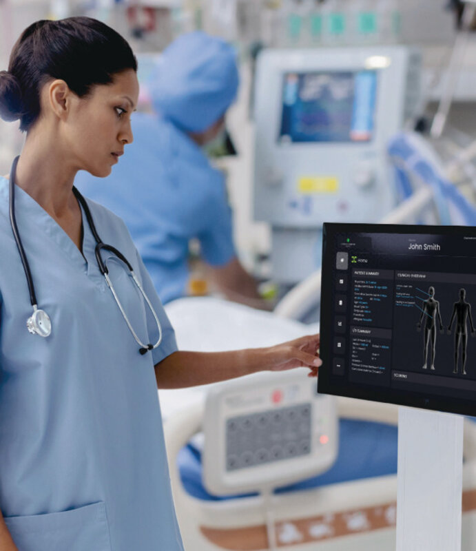 Nurse reviewing real-time patient data on DocBox dashboard tablet
